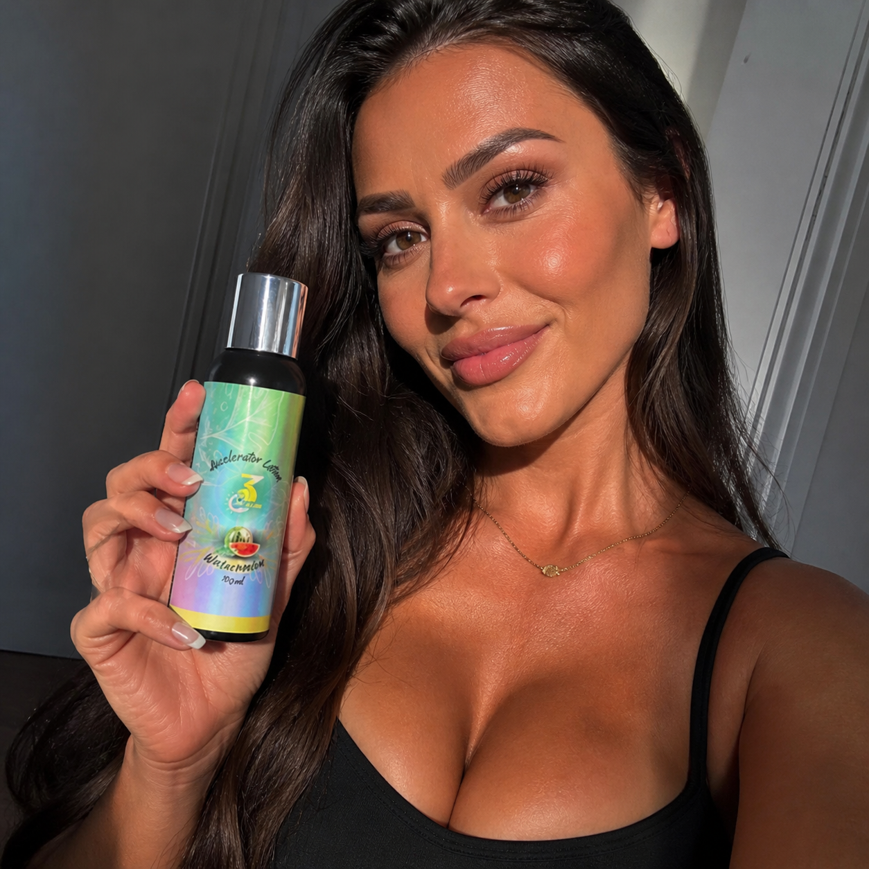 Woman applying 3TheTan accelerator lotion in preparation for tanning